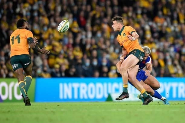 Tom Banks of the Wallabies passes the ball during the international Test match between the Australia Wallabies and France at Suncorp Stadium on July...