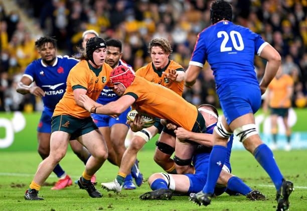 Harry Wilson of the Wallabies is tackled during the international Test match between the Australia Wallabies and France at Suncorp Stadium on July...