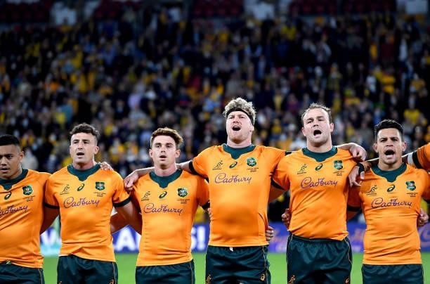 Wallabies players embrace for the national anthem during the international Test match between the Australia Wallabies and France at Suncorp Stadium...