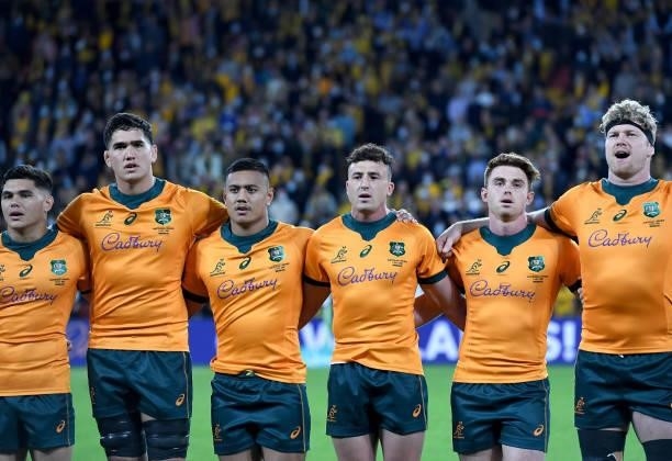 Wallabies players embrace for the national anthem during the international Test match between the Australia Wallabies and France at Suncorp Stadium...