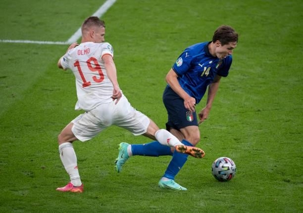 Dani Olmo of Spain and Federico Chiesa of Italy in action during the UEFA Euro 2020 Championship Semi-final match between Italy and Spain at Wembley...