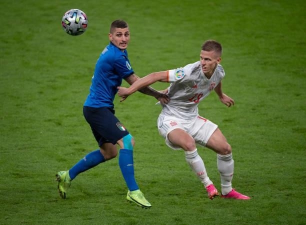 Marco Verratti of Italy and Dani Olmo of Spain in action during the UEFA Euro 2020 Championship Semi-final match between Italy and Spain at Wembley...