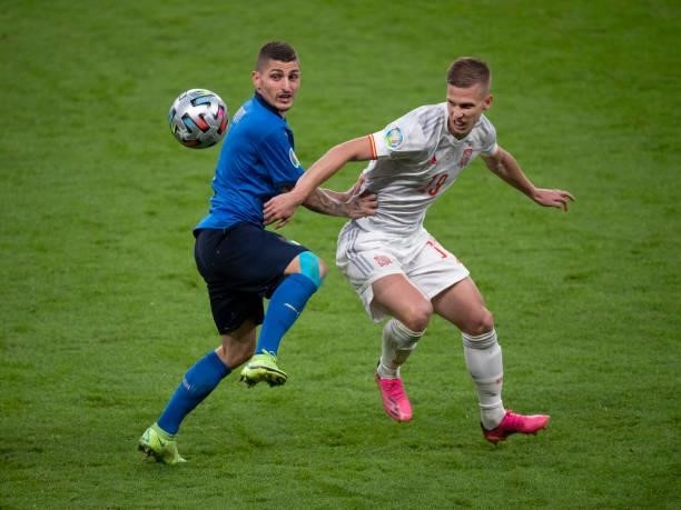 Marco Verratti of Italy and Dani Olmo of Spain in action during the UEFA Euro 2020 Championship Semi-final match between Italy and Spain at Wembley...