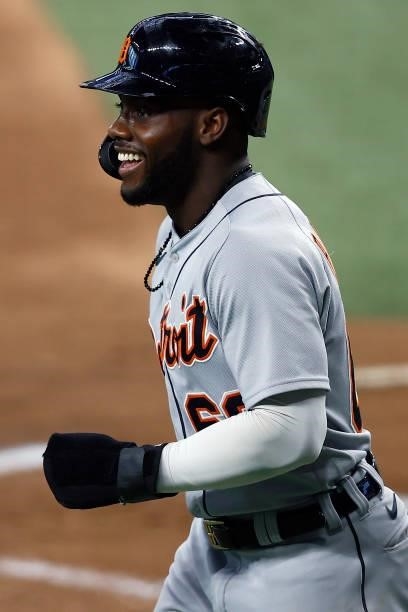 Akil Baddoo of the Detroit Tigers celebrates after scoring on a RBI single hit by Robbie Grossman of the Detroit Tigers in the top of the first...