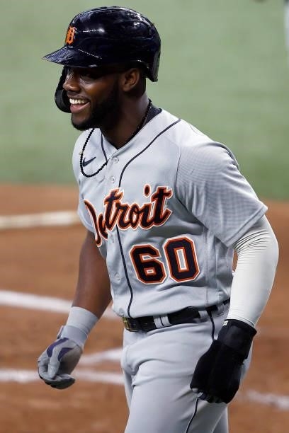 Akil Baddoo of the Detroit Tigers celebrates after scoring on a RBI single hit by Robbie Grossman of the Detroit Tigers in the top of the first...