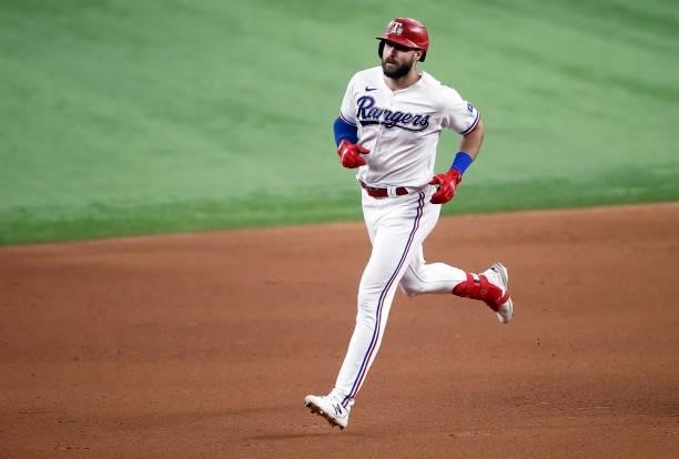 Joey Gallo of the Texas Rangers rounds the bases after hitting a solo home run in the bottom of the fourth inning against the Detroit Tigers at Globe...