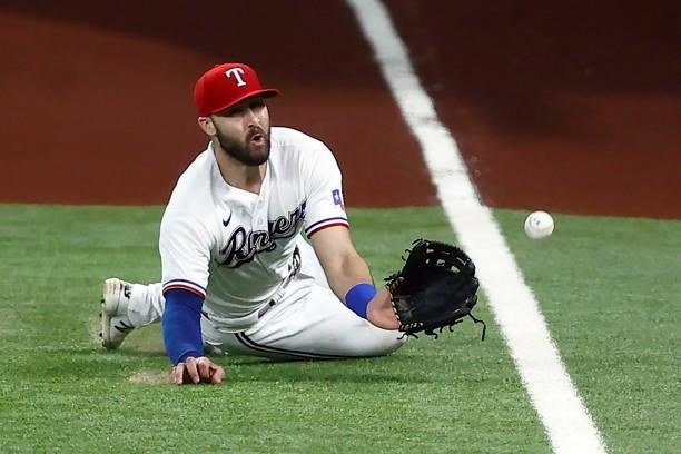 Joey Gallo of the Texas Rangers fails to make the catch on a RBI single hit by Jonathan Schoop of the Detroit Tigers in the top of the seventh inning...