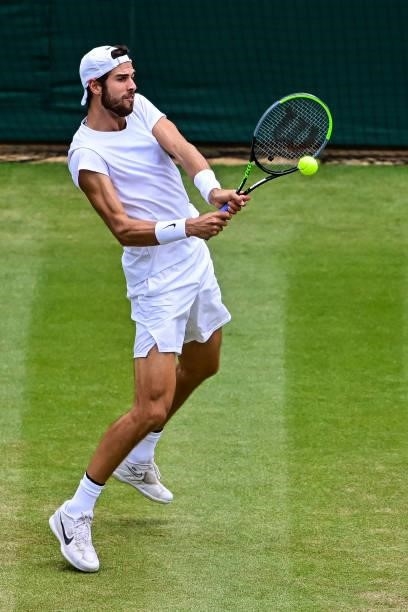 Karen Khachanov of Russia hits a backhand against Dennis Shapovalov of Canada in the quarter finals of the gentlemen's singles during Day Nine of The...