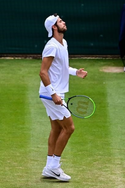 Karen Khachanov of Russia looks frustrated against Dennis Shapovalov of Canada in the quarter finals of the gentlemen's singles during Day Nine of...