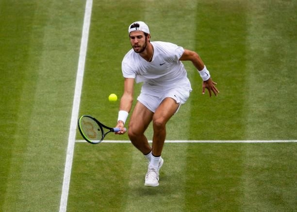 Karen Khachanov of Russia hits a forehand against Dennis Shapovalov of Canada in the quarter finals of the gentlemen's singles during Day Nine of The...