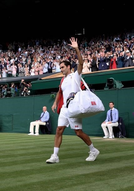 Roger Federer of Switzerland walks off court after losing his men's Singles Quarter Final match against Hubert Hurkacz of Poland on Day Nine of The...