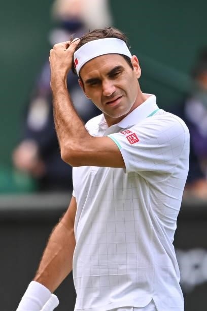 Roger Federer of Switzerland looks frustrated during his match against Hubert Hurkacz of Poland in the quarter finals of the gentlemen's singles...