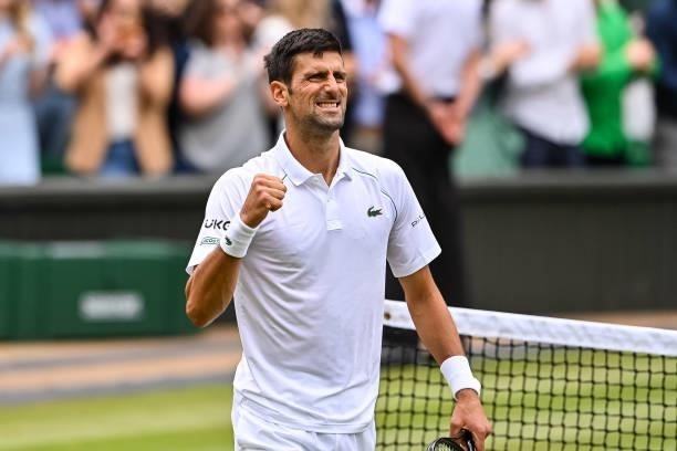 Novak Djokovic of Serbia celebrates his victory over Marton Fucsovics of Hungary in the quarter finals of the gentlemen's singles during Day Nine of...