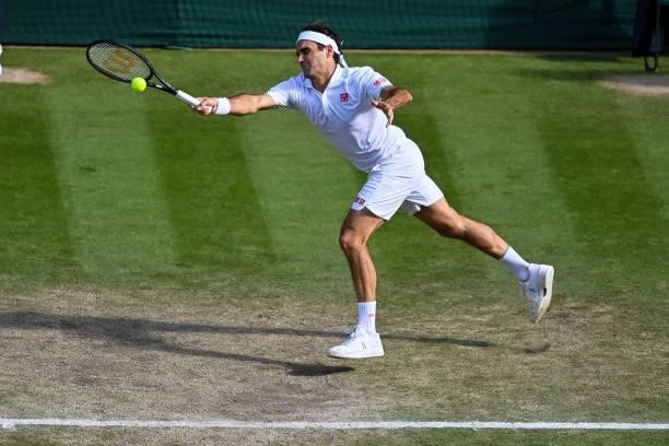 Roger Federer of Switzerland hits a forehand against Hubert Hurkacz of Poland in the quarter finals of the gentlemen's singles during Day Nine of The...