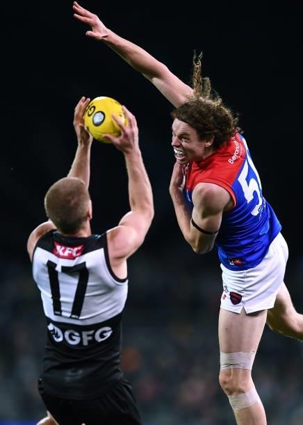 Tom Clurey of Port Adelaide marks behind Ben Brown of the Demons during the round 17 AFL match between Port Adelaide Power and Melbourne Demons at...
