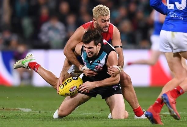 Sam Mayes of Port Adelaide tackled by Christian Salem of the Demons during the round 17 AFL match between Port Adelaide Power and Melbourne Demons at...
