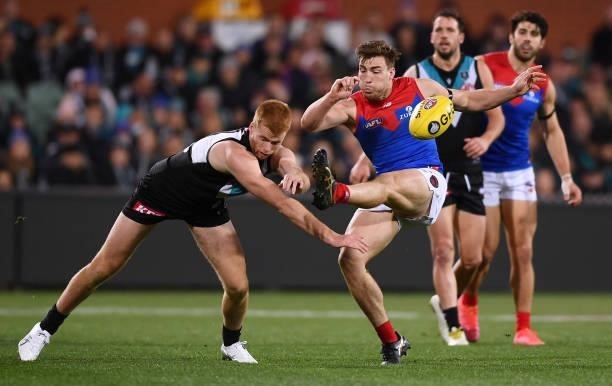 Willem Drew of Port Adelaide smothers a Jack Viney of the Demons kick during the round 17 AFL match between Port Adelaide Power and Melbourne Demons...