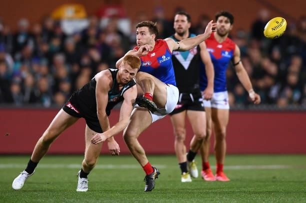 Willem Drew of Port Adelaide smothers a Jack Viney of the Demons kick during the round 17 AFL match between Port Adelaide Power and Melbourne Demons...