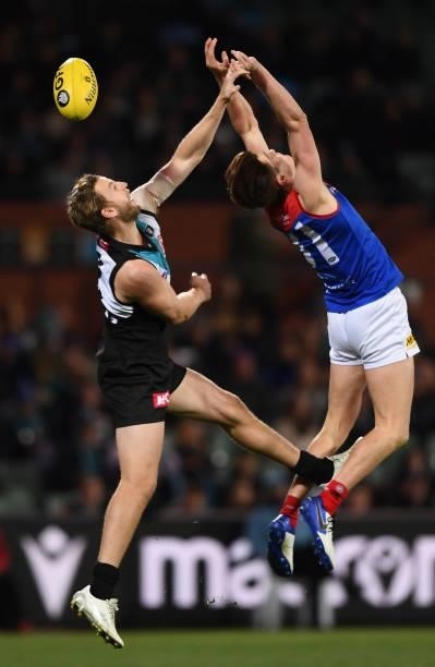 Trent McKenzie of Port Adelaide spoils Bailey Frisch of the Demons during the round 17 AFL match between Port Adelaide Power and Melbourne Demons at...