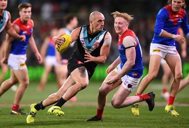 Sam Powell-Pepper of Port Adelaide competes with Clayton Oliver of the Demons during the round 17 AFL match between Port Adelaide Power and Melbourne...