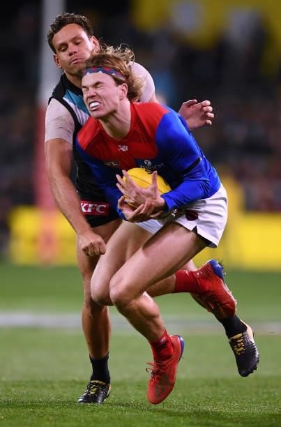 Jayden Hunt of the Demons marks in front of Steven Motlop of Port Adelaide during the round 17 AFL match between Port Adelaide Power and Melbourne...