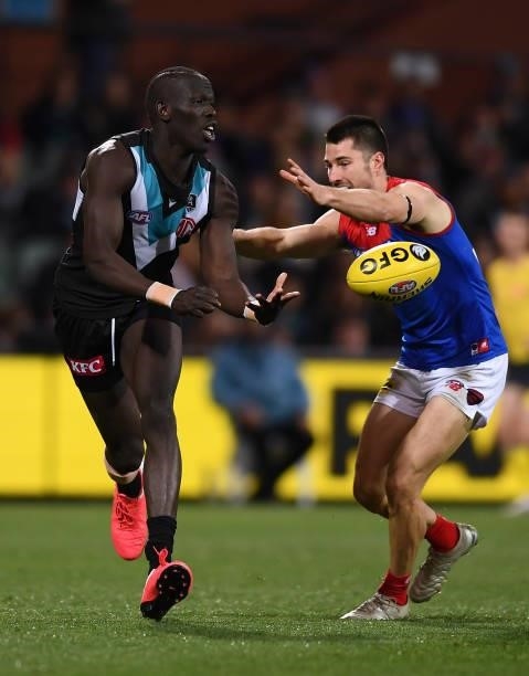 Aliir Aliir of Port Adelaide handballs during the round 17 AFL match between Port Adelaide Power and Melbourne Demons at Adelaide Oval on July 08,...