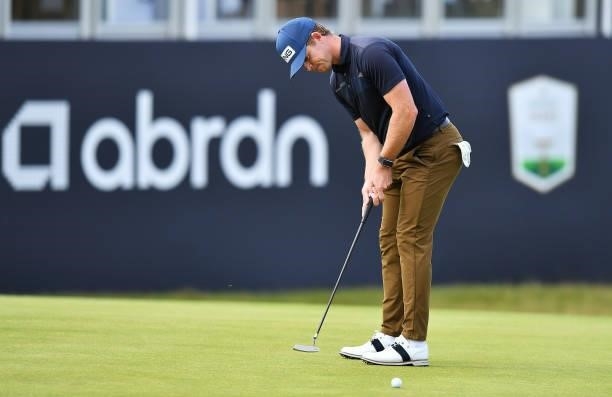 Brandon Stone of South Africa makes a putt on the 18th green during Day One of the abrdn Scottish Open at The Renaissance Club on July 08, 2021 in...