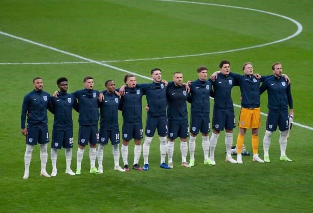 The England team sing the national anthem before the UEFA Euro 2020 Championship Semi-final match between England and Denmark at Wembley Stadium on...
