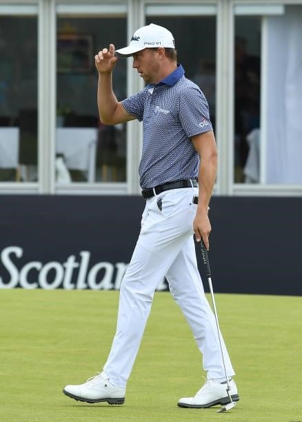 Justin Thomas of the United States acknowledges the crowd, after finishing his round during Day One of the abrdn Scottish Open at The Renaissance...