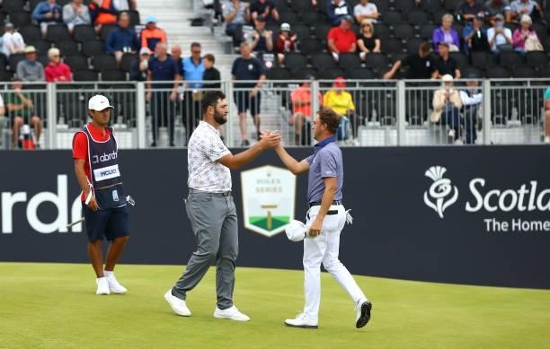 Justin Thomas of the United States and Jon Rahm of Spain congratulate each other after their round during Day One of the abrdn Scottish Open at The...