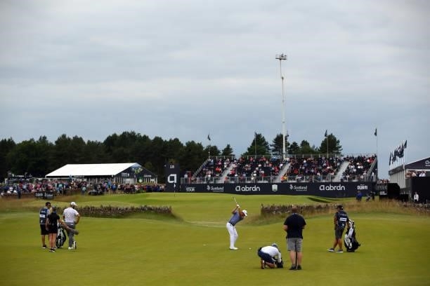 Justin Thomas of the United States plays his second shot on the 18th hole during Day One of the abrdn Scottish Open at The Renaissance Club on July...