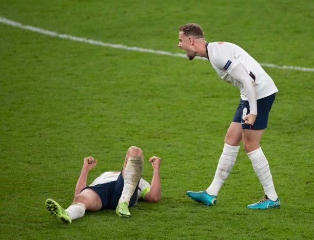 Harry Kane and Jordan Henderson of England celebrate at the final whistle after the UEFA Euro 2020 Championship Semi-final match between England and...