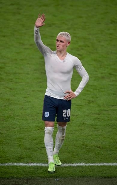 Phil Foden of England waves to the crowd after the UEFA Euro 2020 Championship Semi-final match between England and Denmark at Wembley Stadium on...