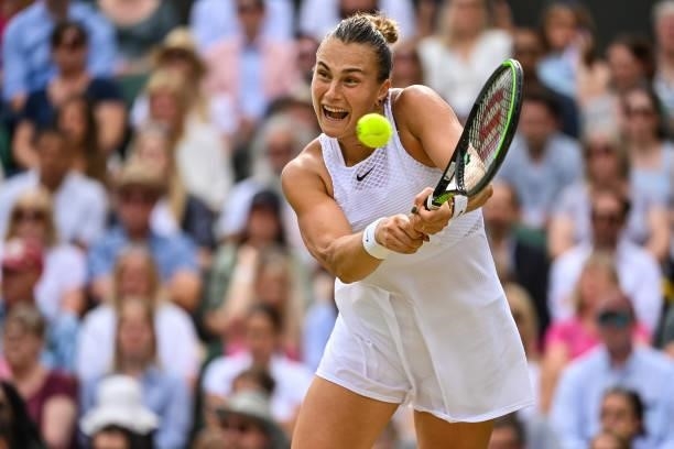 Aryna Sabalenka of Belarus hits a backhand against Karolina Pliskova of the Czech Republic in the Semi-finals of the ladies singles during Day Ten of...