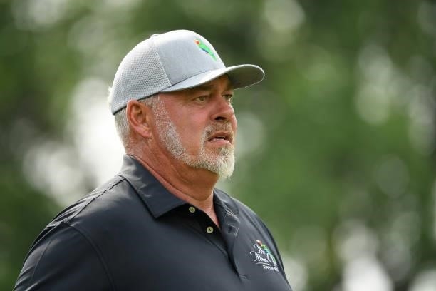 Darren Clarke of Northern Ireland plays his shot from the ninth tee during the first round of the U.S. Senior Open Championship at the Omaha Country...