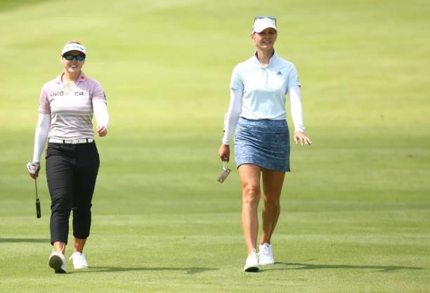Brooke Henderson of Canada walks to the 10th green with Jessica Korda green during the first round of the Marathon LPGA Classic presented by Dana at...