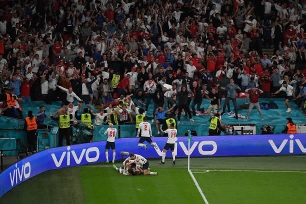 England players and fans celebrate the winning goal by Harry Kane during the UEFA Euro 2020 Championship Semi-final match between England and Denmark...
