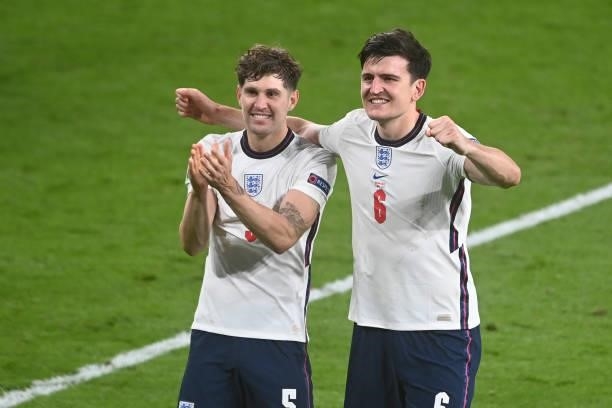 Harry Maguire and John Stones of England celebrate after the UEFA Euro 2020 Championship Semi-final match between England and Denmark at Wembley...