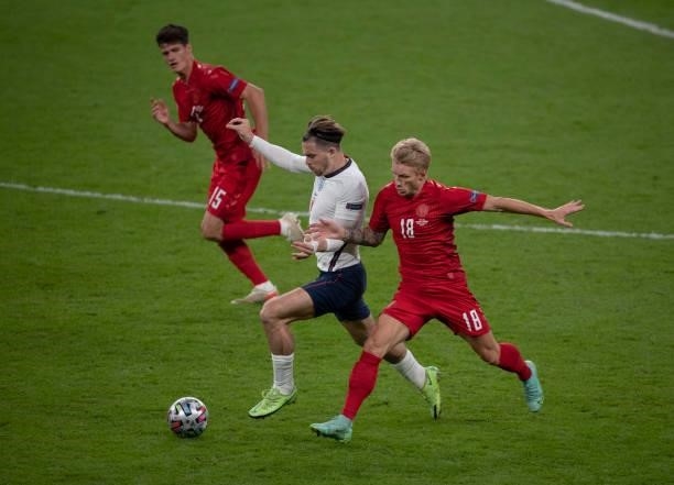 Jack Grealish of England in action with Daniel Wass and Christian Nørgaard of Denmark during the UEFA Euro 2020 Championship Semi-final match between...