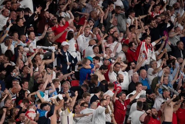 England fans celebrate their second goal during the UEFA Euro 2020 Championship Semi-final match between England and Denmark at Wembley Stadium on...