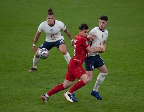 Declan Rice and Kalvin Phillips of England in action with Pierre-Emile Højbjerg of Denmark during the UEFA Euro 2020 Championship Semi-final match...