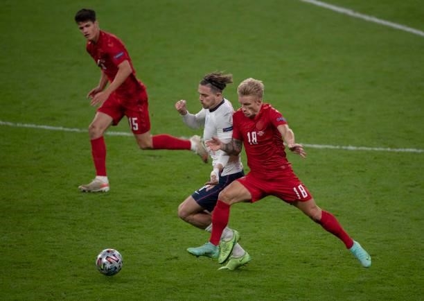 Jack Grealish of England in action with Daniel Wass and Christian Nørgaard of Denmark during the UEFA Euro 2020 Championship Semi-final match between...