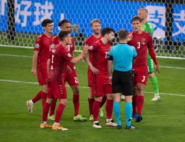 Denmark players complain to referee after Danny Makkelie after he awards a penalty to England during the UEFA Euro 2020 Championship Semi-final match...