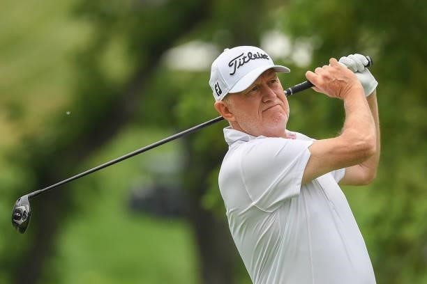 Roger Chapman of England plays his shot from the fourth tee during the first round of the U.S. Senior Open Championship at the Omaha Country Club on...