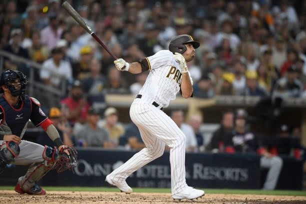 Daniel Camerena of the San Diego Padres hits a grand slam home run during the fourth inning of a baseball game against Washington Nationals at PETCO...