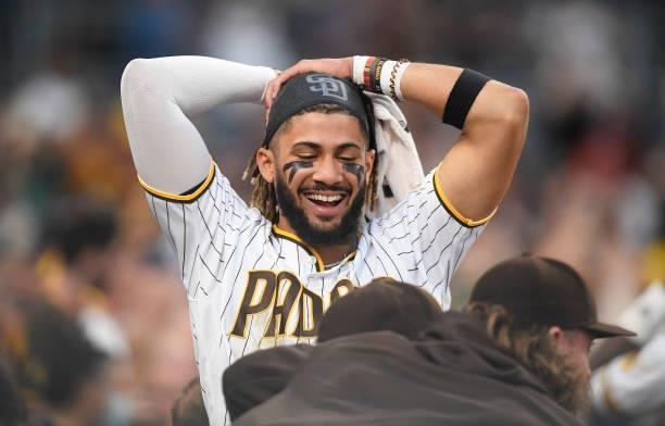 Fernando Tatis Jr. #23 of the San Diego Padres reacts after Daniel Camerena hit a grand slam home run during the fourth inning of a baseball game...