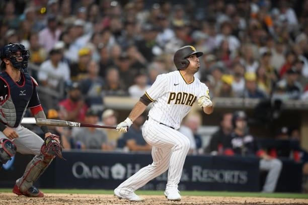Daniel Camerena of the San Diego Padres hits a grand slam home run during the fourth inning of a baseball game against Washington Nationals at PETCO...