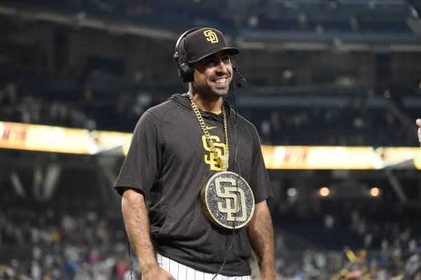 Daniel Camerena of the San Diego Padres wears the swagg chain while being interviewed after a baseball game against Washington Nationals at Petco...