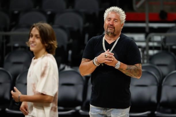 Television personality Guy Fieri watches his son Hunter on the court following game two of the NBA Finals between the Phoenix Suns and the Milwaukee...