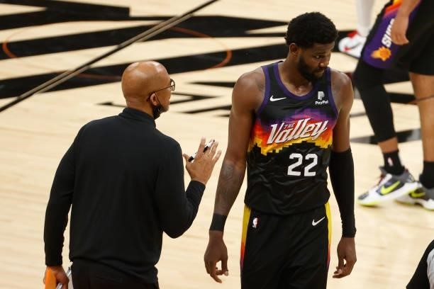 Head coach Monty Williams of the Phoenix Suns talks with Deandre Ayton in the second half of game two of the NBA Finals at Phoenix Suns Arena on July...